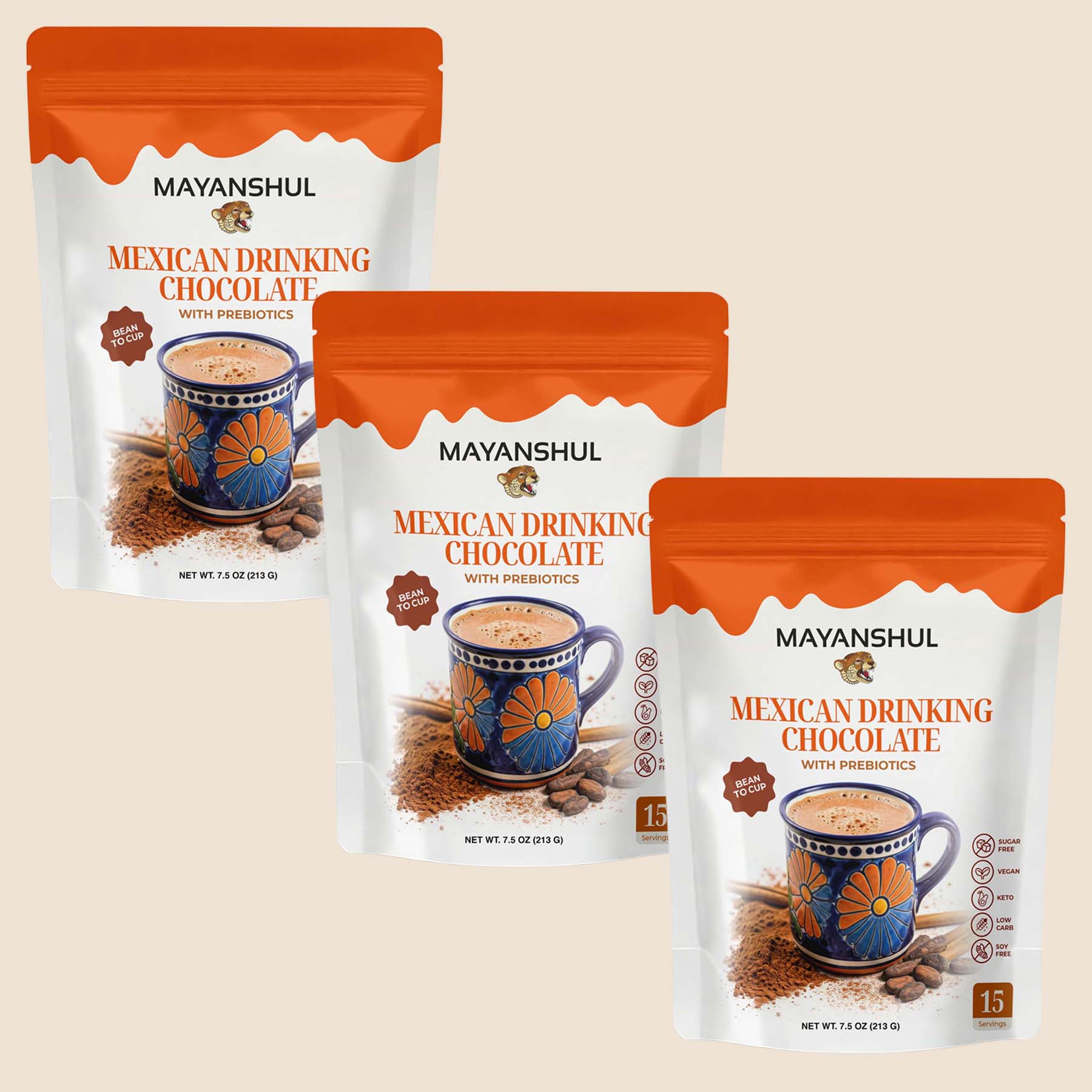 Three packages of Mayanshul Mexican Drinking Chocolate on a beige background