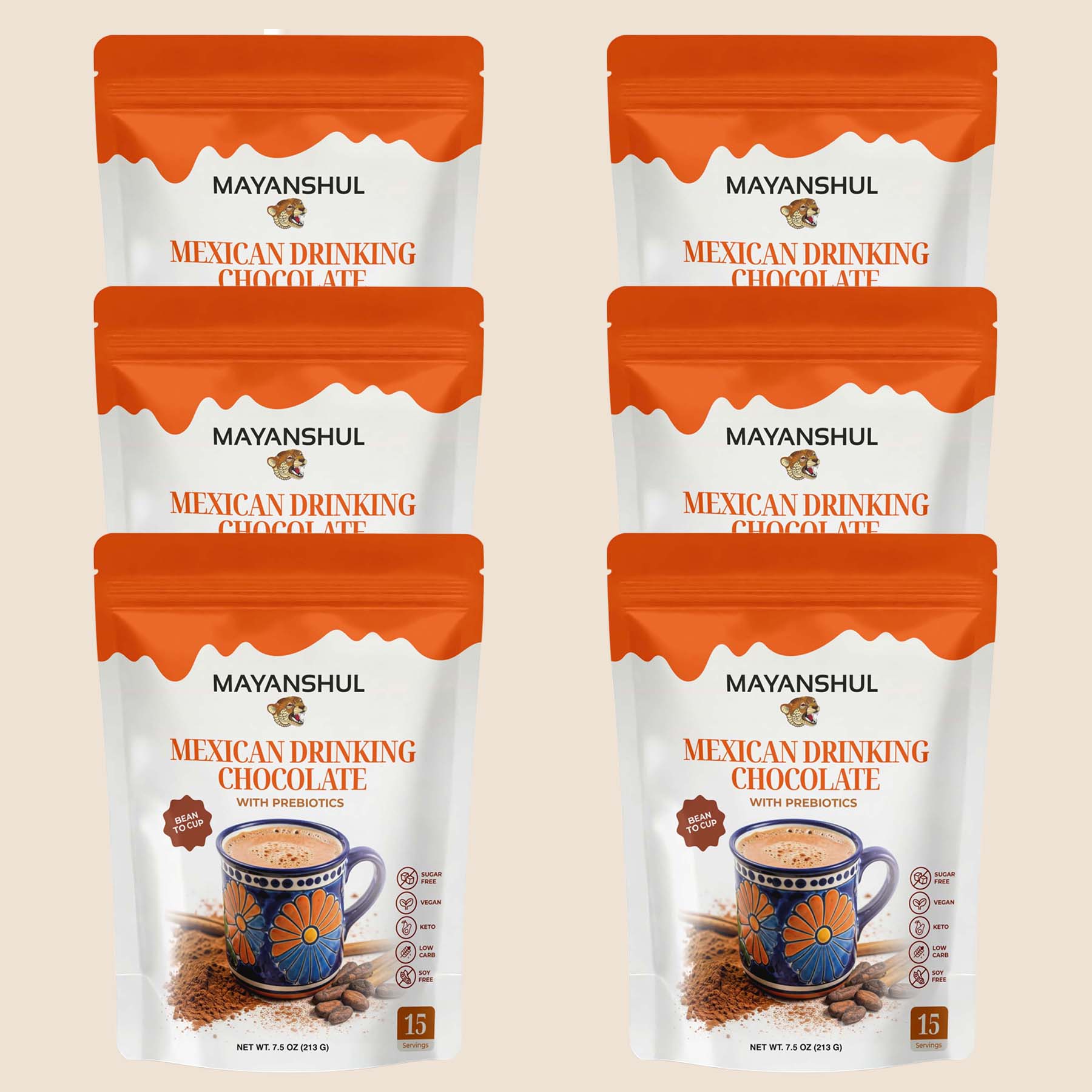 Multiple packages of Mayanshul Mexican Drinking Chocolate on a beige background