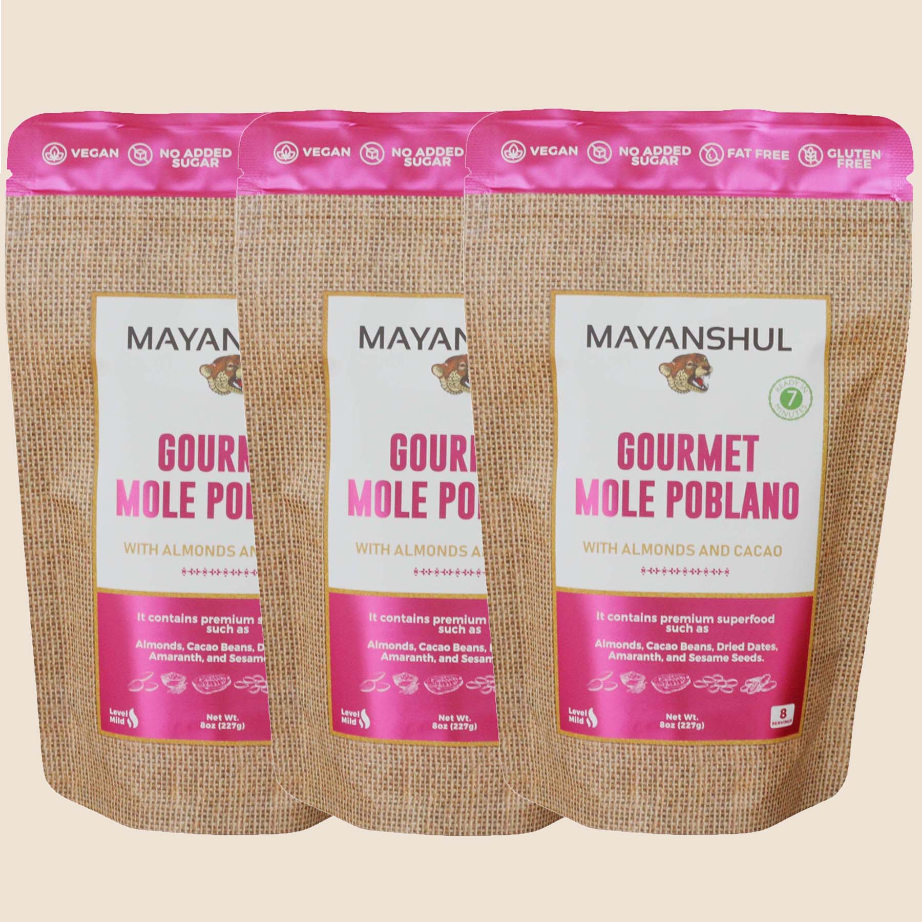 A package of Mayanshul Gourmet Mole Poblano with almonds and cacao, labeled vegan, no added sugar, fat, dairy, and artificial colors or flavors.